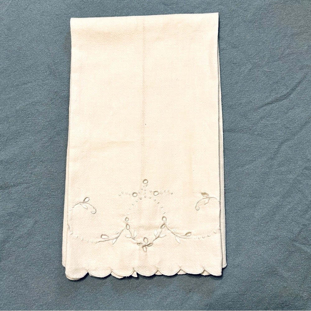 Antique hand towel with scalloped edges